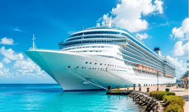 Large white cruise ship docked at a tropical port under a bright blue sky