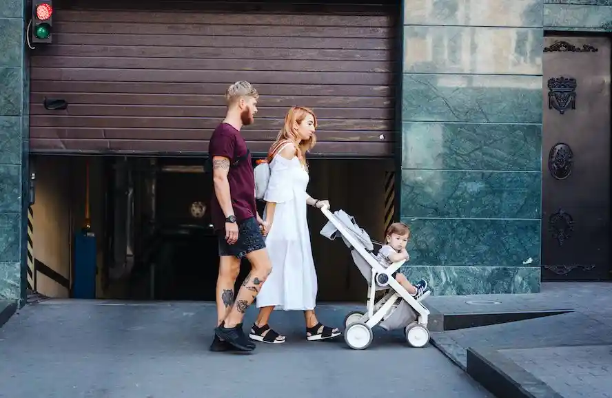 man and woman with a stroller - Cloud of Goods