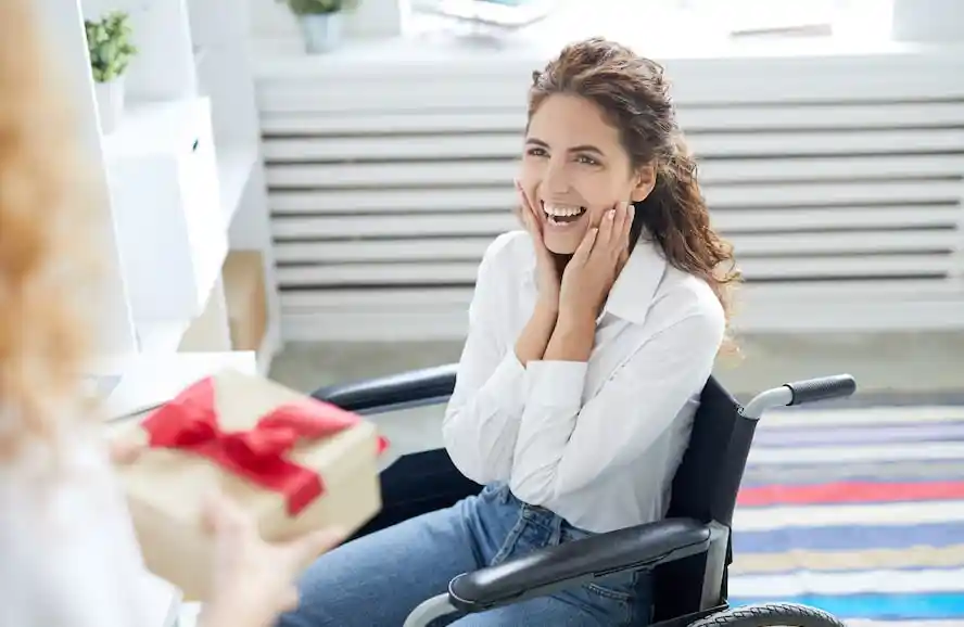Happy girl on wheelchair - Cloud of Goods